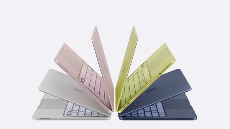 A lineup of MacBook Neo laptops in various bright color options.