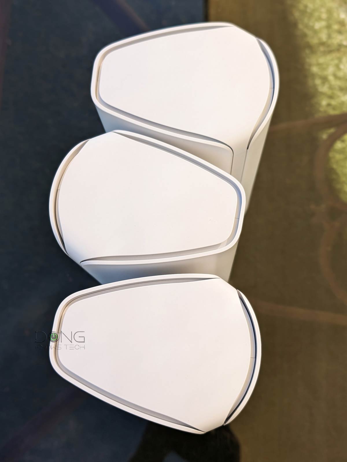 Top-down view of the Netgear Orbi 770 series showing the ventilation and sleek upper casing.