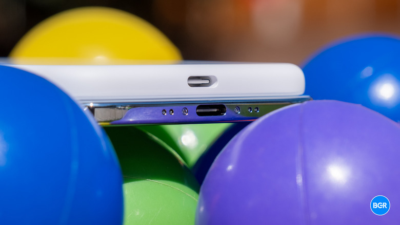 An iPhone Air connected to a MagSafe battery pack via its USB-C port.