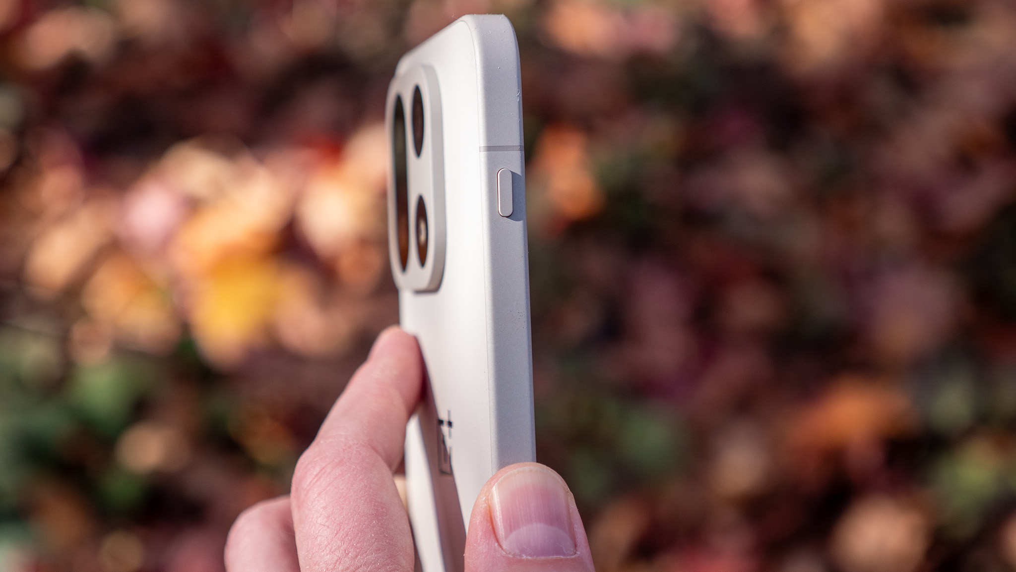 Close-up side view of the OnePlus 15 showing the new Plus Key.