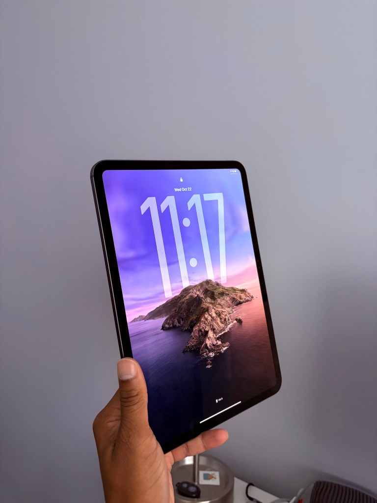 Side view of the 11-inch M5 iPad Pro in Space Black.