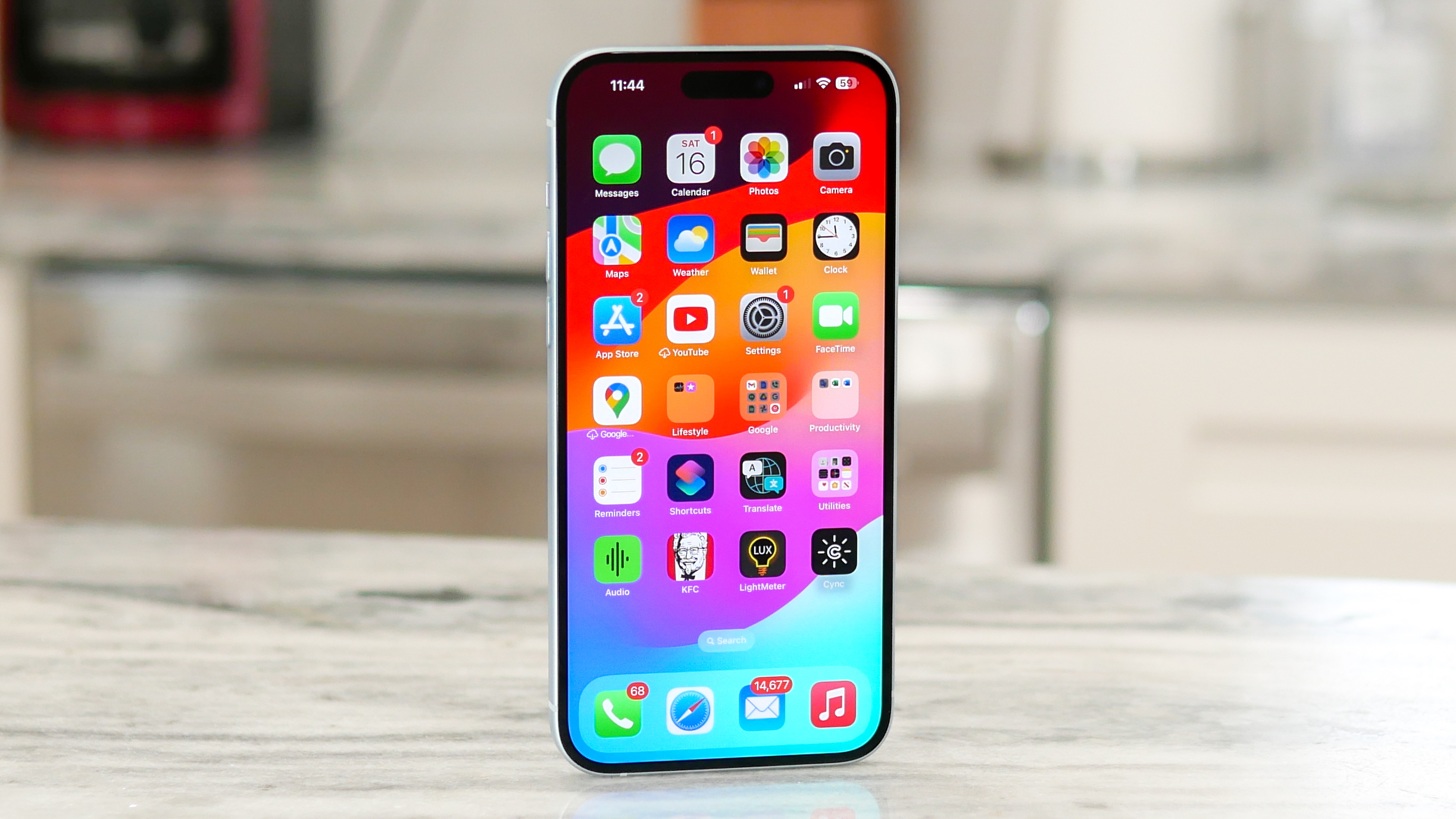 iPhone 15 Plus held in hand for the final verdict