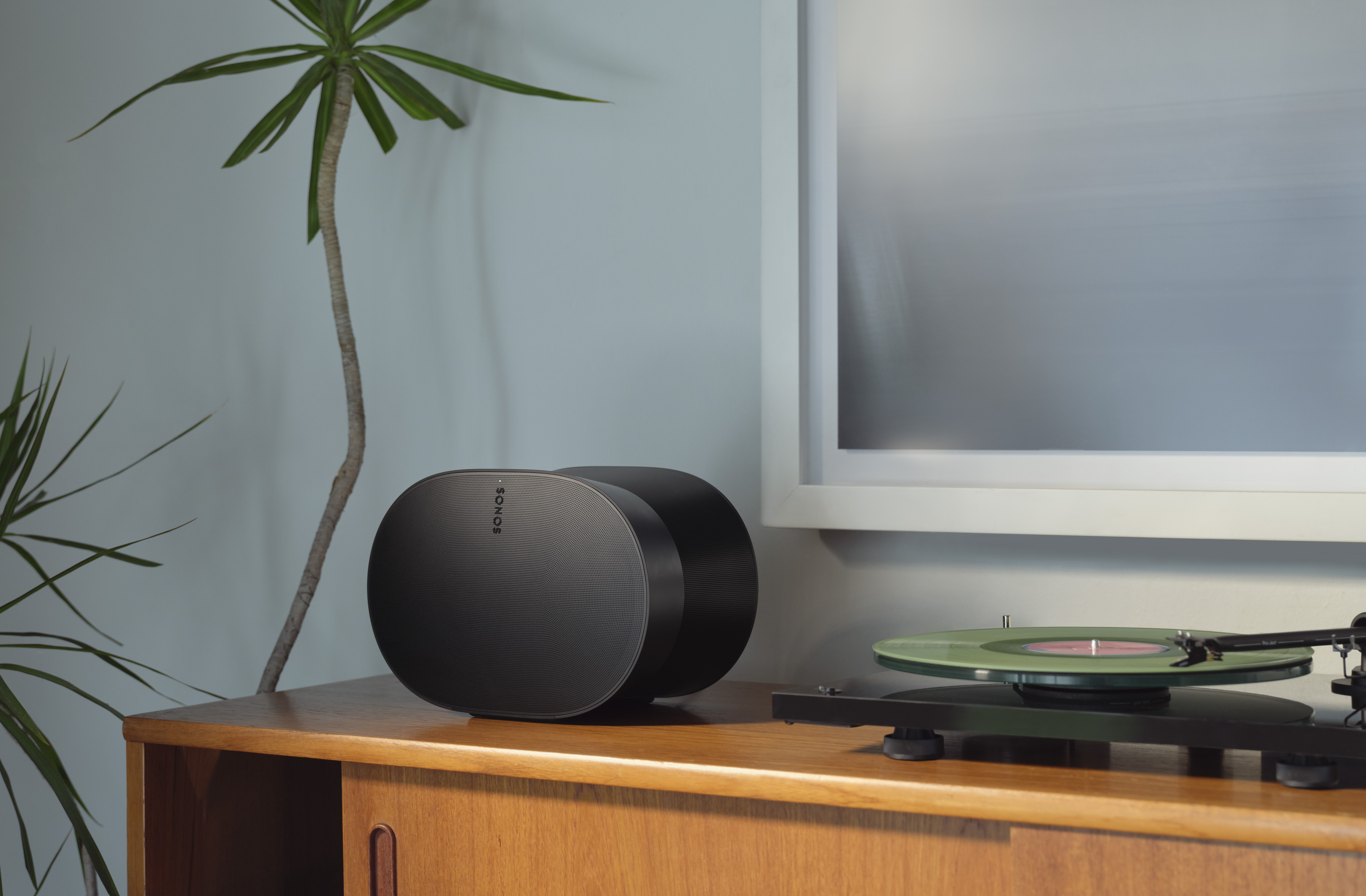 A Sonos speaker integrated into a cozy, modern living room setup.