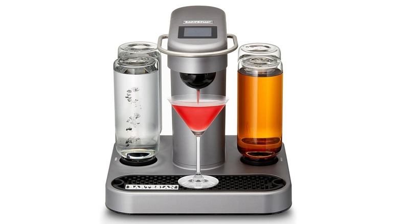 The Bartesian 55300 cocktail maker preparing a drink with colorful liquor bottles attached.