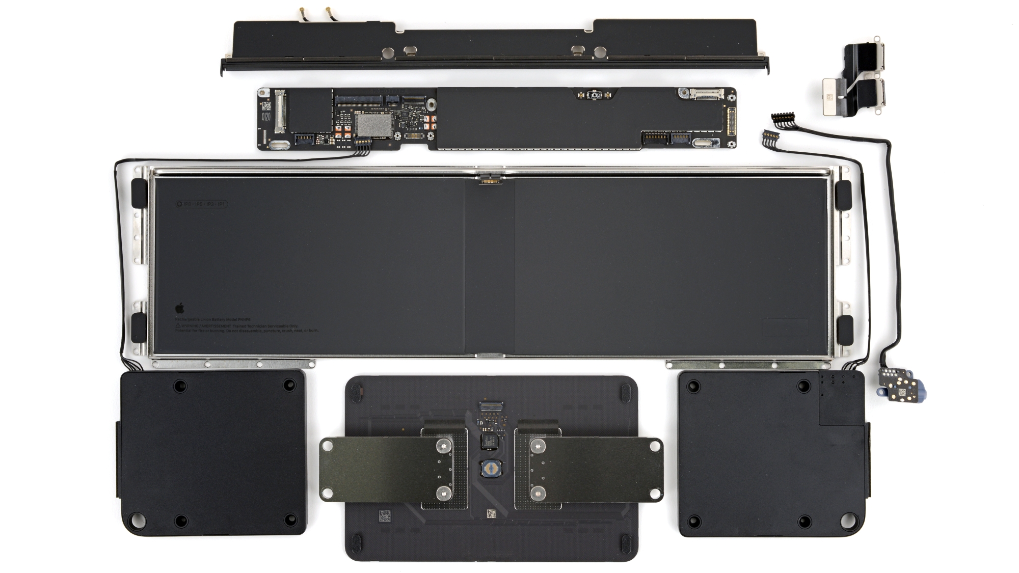 Exploded view of the MacBook Neo with battery, speakers, and logic board removed.