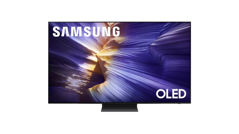 Front view of the Samsung S90F 4K Smart TV in a living room.