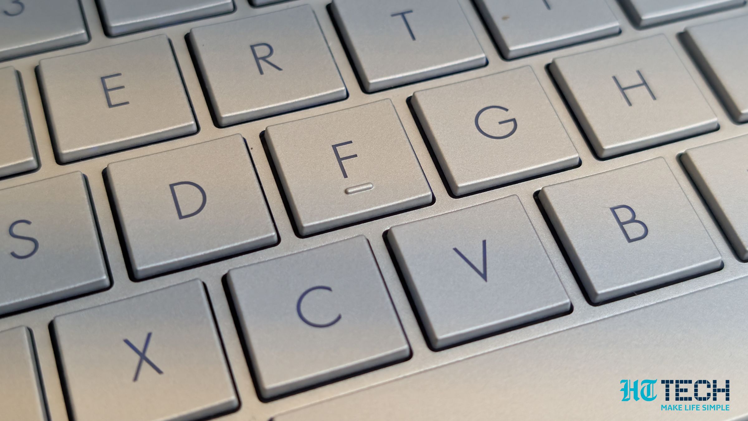 A close-up top-down view of the laptop keyboard and touchpad.