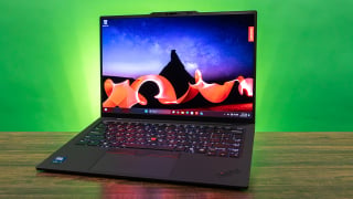 Angled view of the Lenovo ThinkPad X1 Carbon Gen 13 laptop showing its thin profile and signature keyboard.