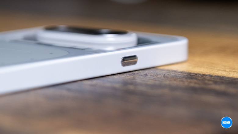 A close-up shot of the Essential Key button on the side of the Nothing Phone (4a).