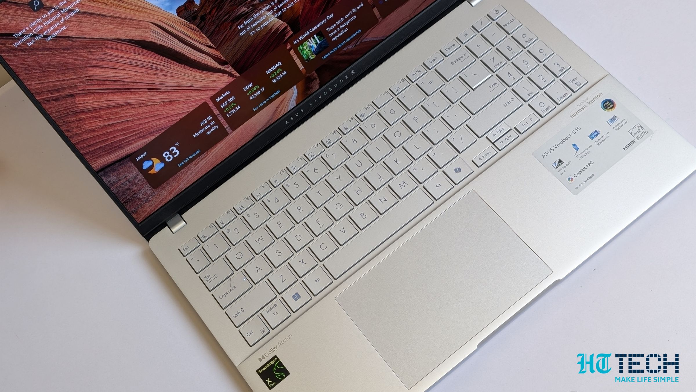 The ASUS Vivobook S15 in Cool Silver finish on a desk.