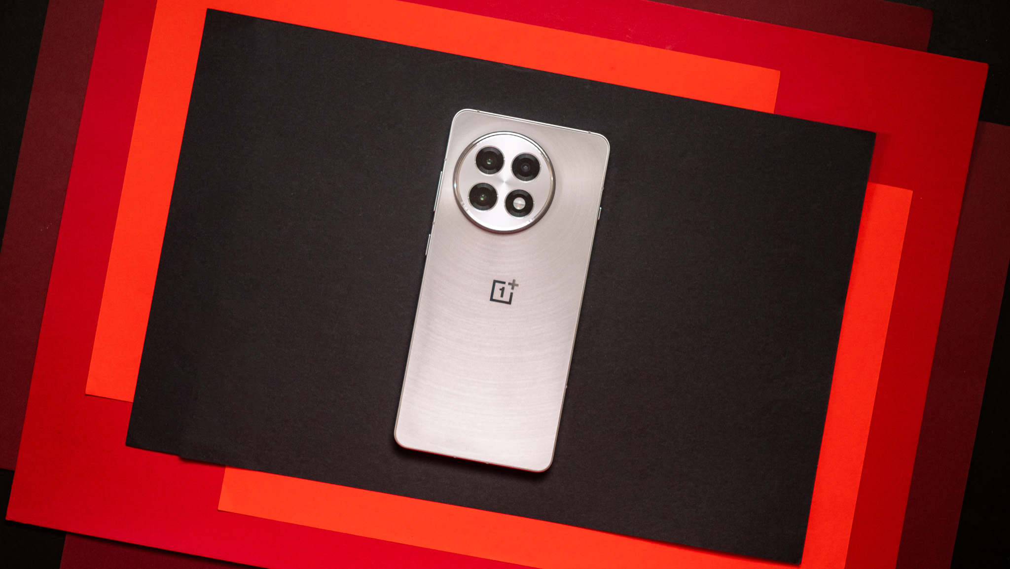 An outdoor shot of a person using a OnePlus 13R.