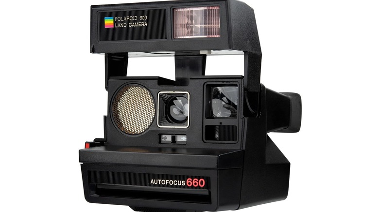 A front view of a black Polaroid Sun 660 Instant Film Camera.
