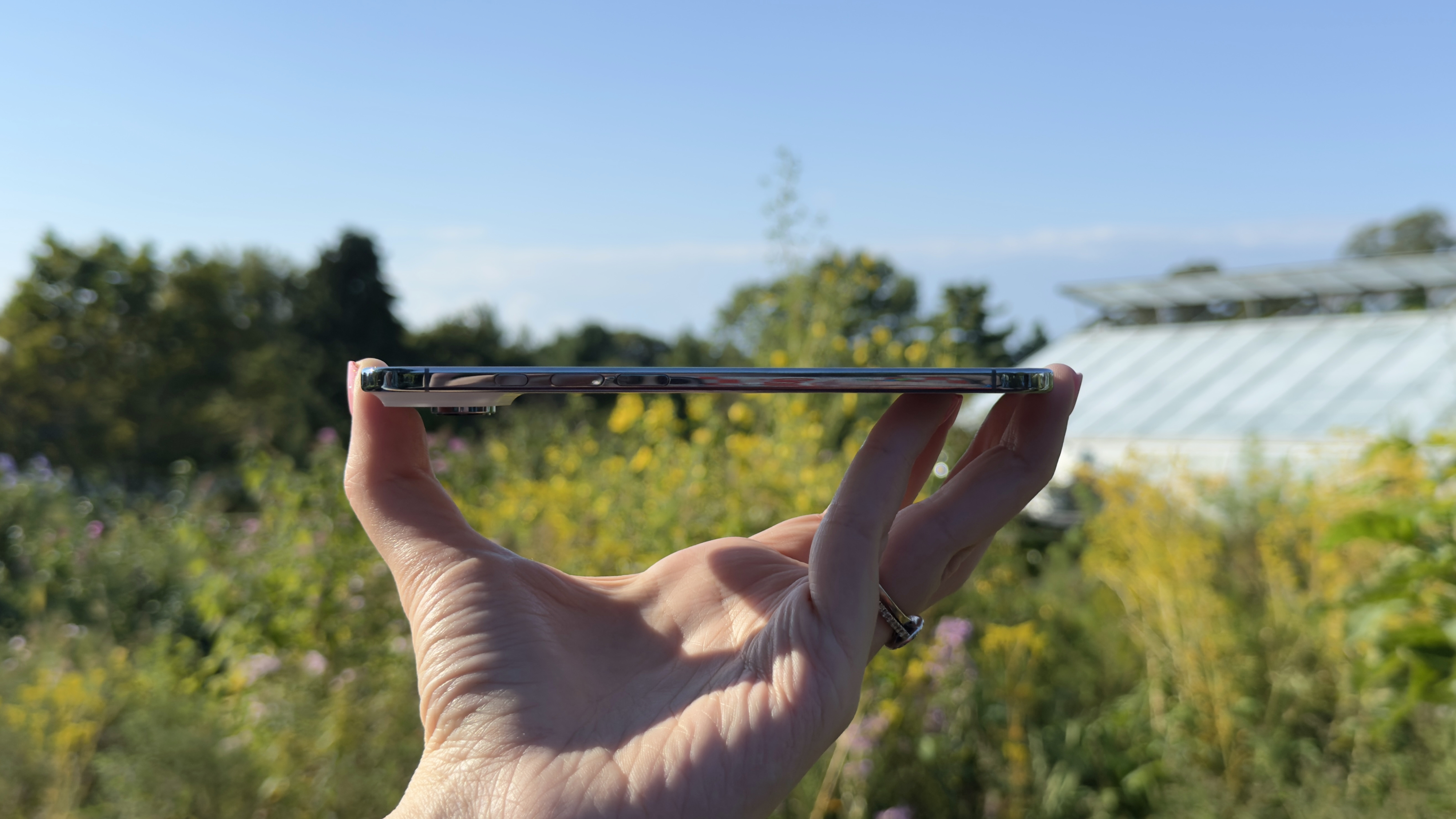 Side-by-side profile comparison of the iPhone Air and a thicker Pro model.
