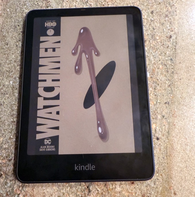 Kindle Colorsoft displaying a vibrant color book cover on its E-Ink screen.