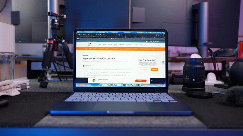 Close-up of the MacBook Neo's keyboard and large haptic trackpad.