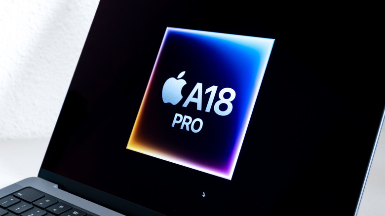 Detailed close-up of the A18 Pro silicon chip on a motherboard.