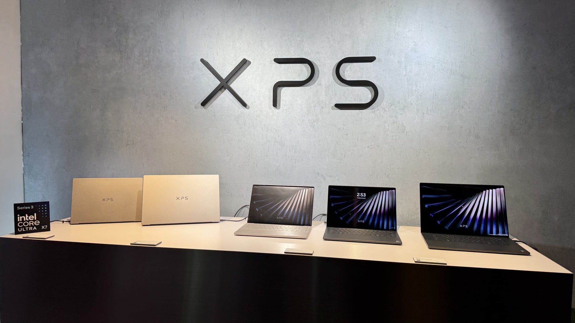 Group photo of multiple Dell XPS laptops on display at CES 2026.