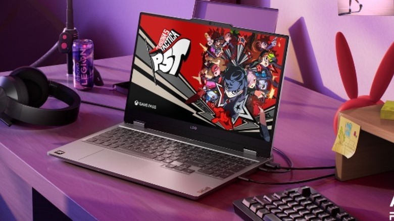 A Lenovo LOQ 15 laptop on a desk playing a game from the Xbox Game Pass library.