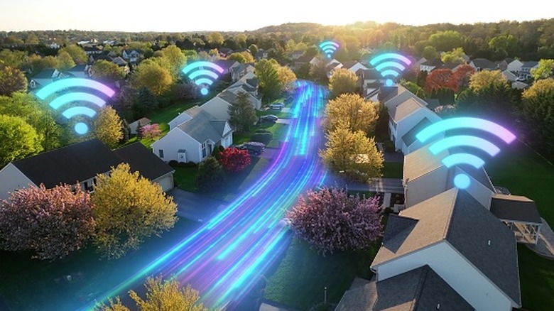 A 3D visualization of radio waves and Wi-Fi signals spreading through the rooms of a multi-story family home.