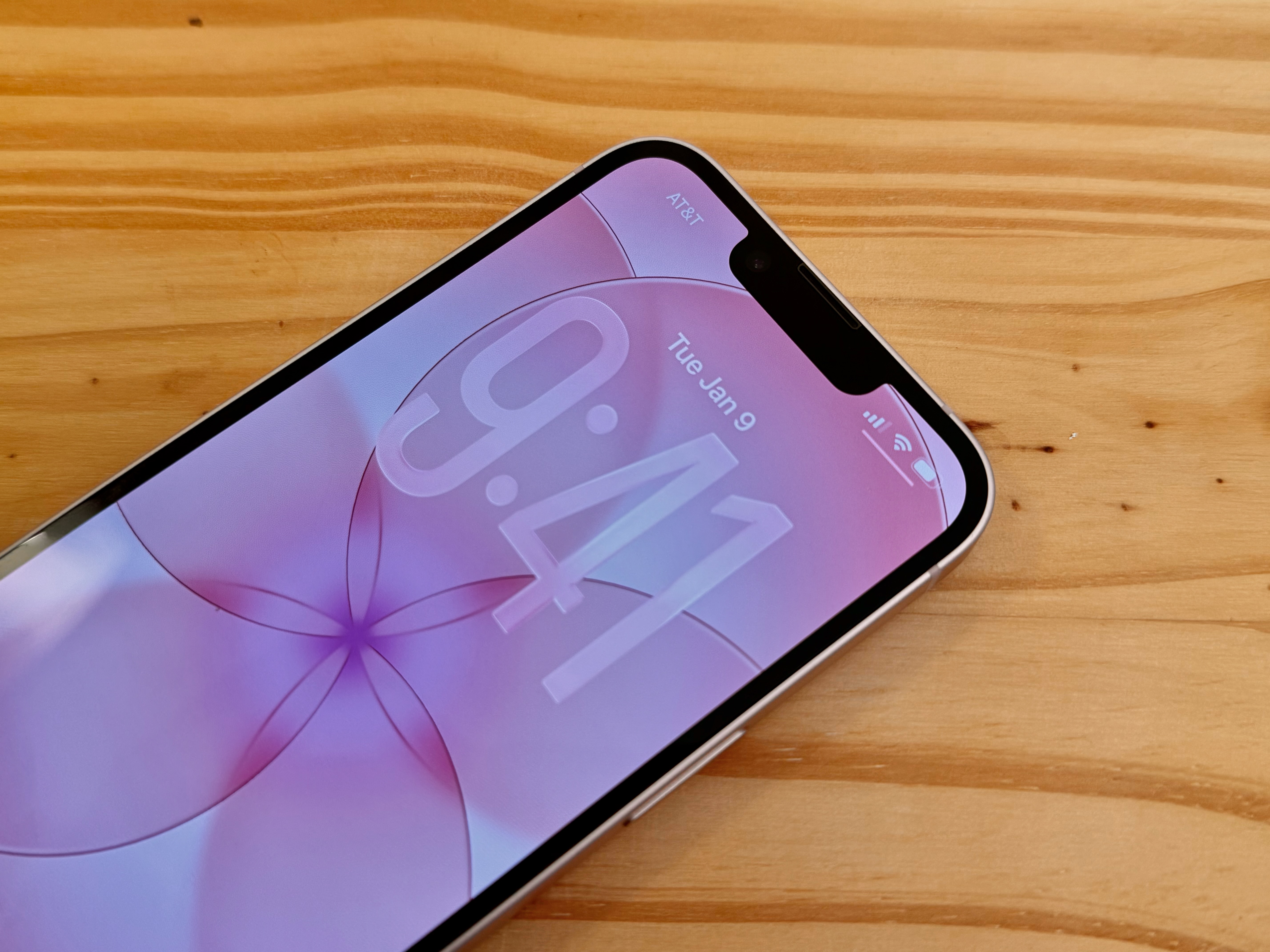 Close-up of a pink iPhone 17e screen showing the classic notch at the top.
