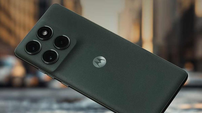 The Motorola Edge 2025 smartphone shown in an urban setting, highlighting its slim profile.