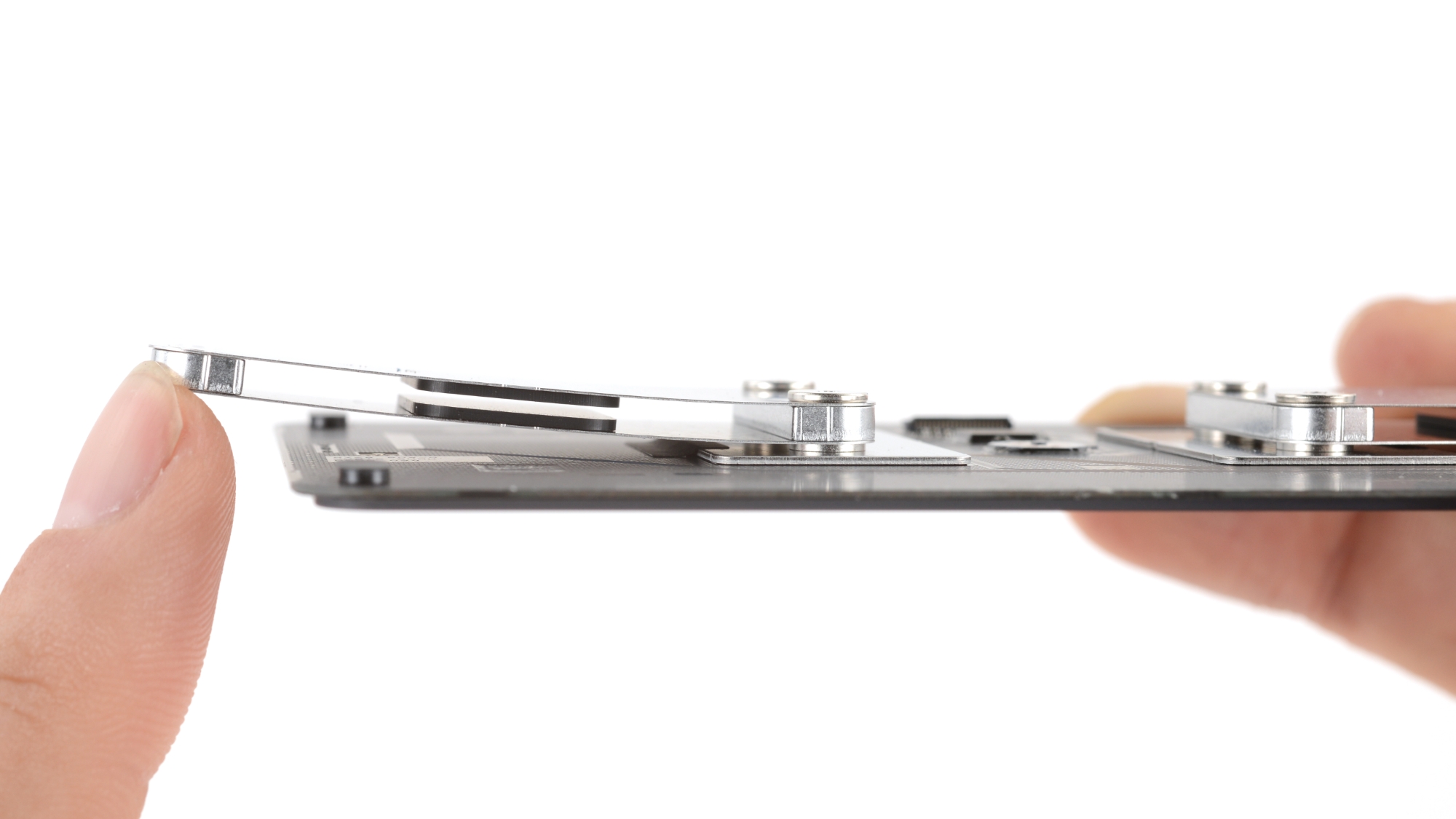 The underside of the MacBook Neo mechanical trackpad assembly.