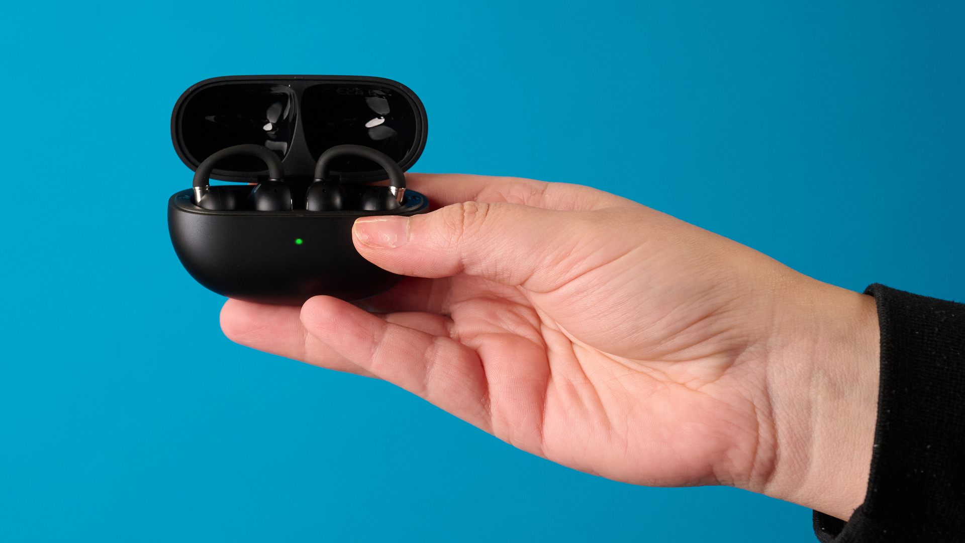 Macro shot of the flexible bridge connecting the two parts of the EarFun Clip 2 earbud