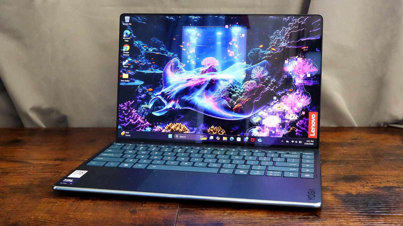 The Lenovo Yoga Slim 9i Gen 10 featuring a vibrant 4K OLED display.