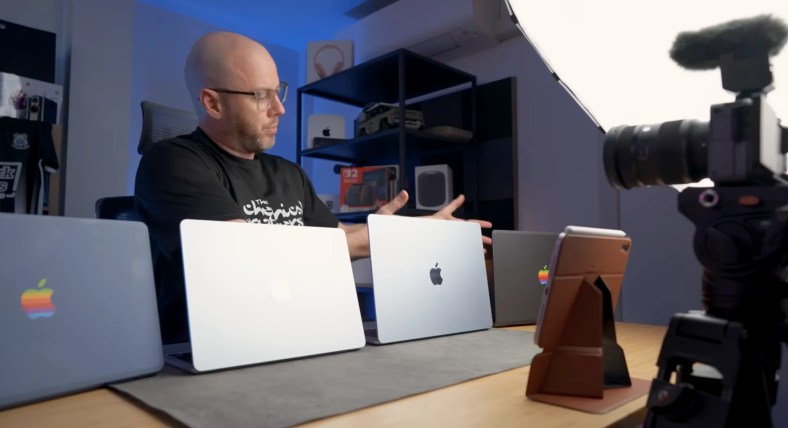 A group shot featuring the MacBook Neo alongside MacBook Air and MacBook Pro models for size and design comparison.