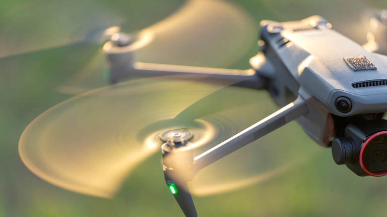 Close-up of a drone's camera and 3-axis gimbal stabilization system.