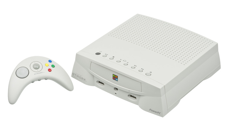 Front view of the white Apple Pippin game console and its controller.
