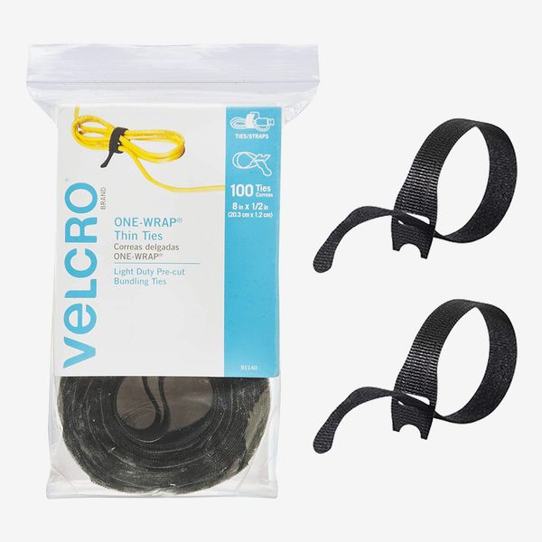 A bulk pack of black Velcro Brand One Wrap cable ties.