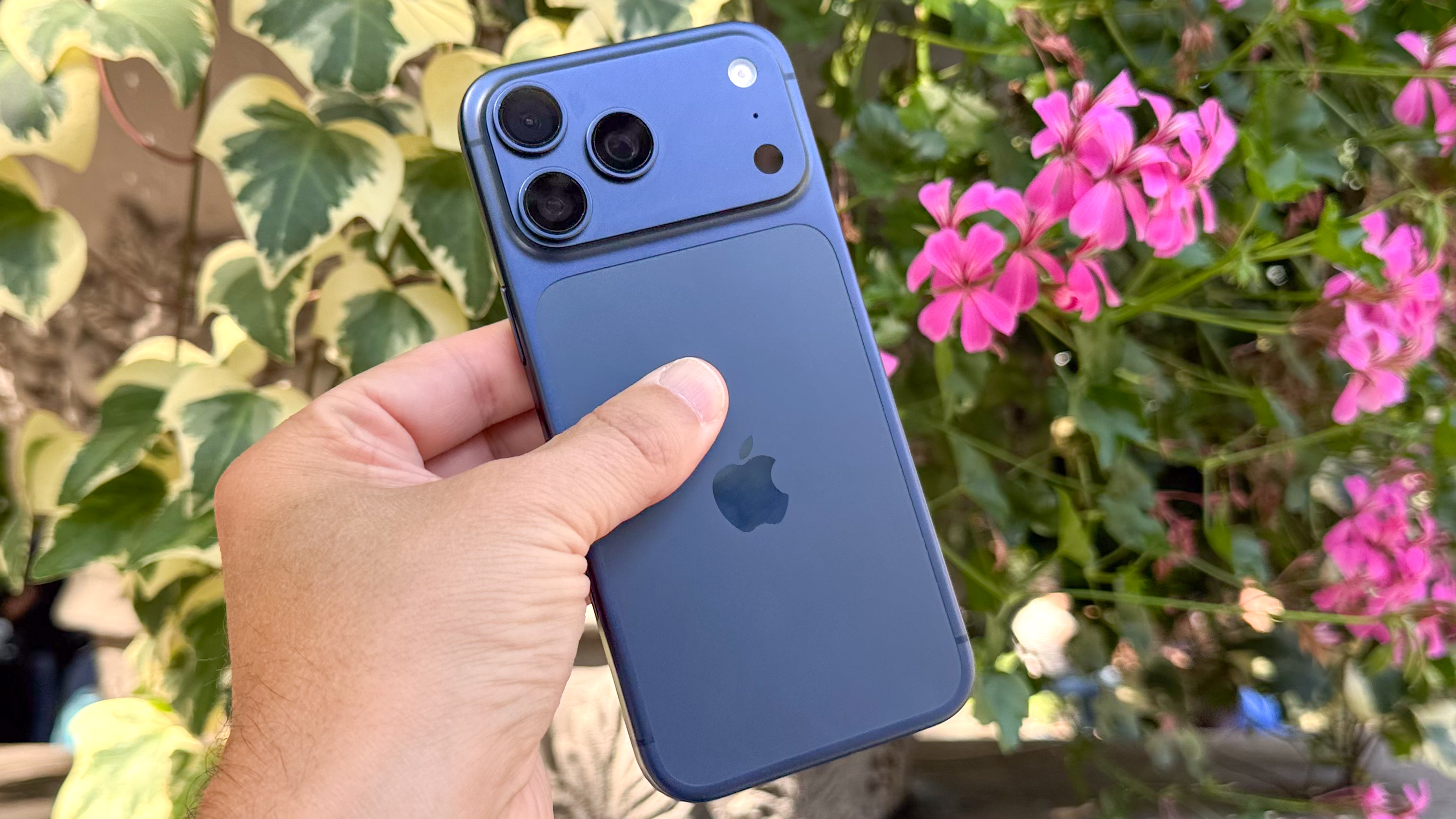 A person holding the iPhone 17 Pro Max to demonstrate its size and ergonomics.