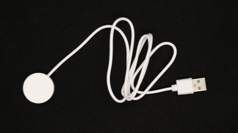 A magnetic smartwatch charging puck.