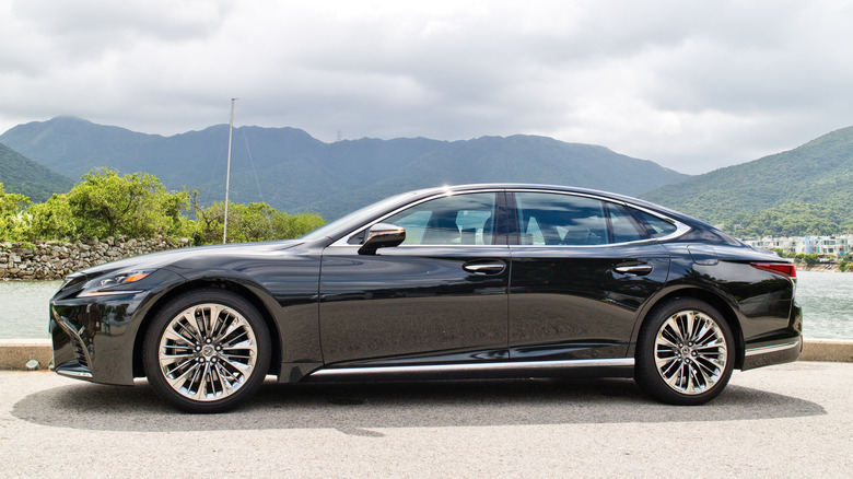 Side profile of a black 2018 Lexus LS luxury sedan.