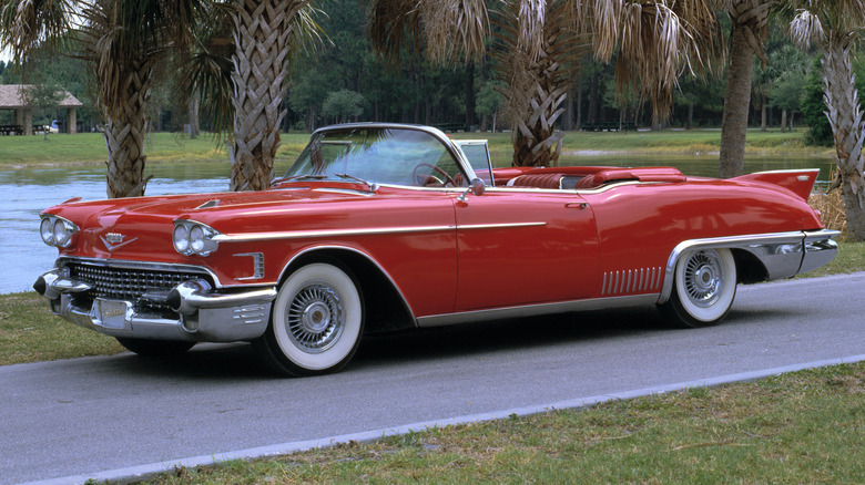 A white 1957 Cadillac Eldorado Biarritz showing its iconic tailfins and chrome detailing.