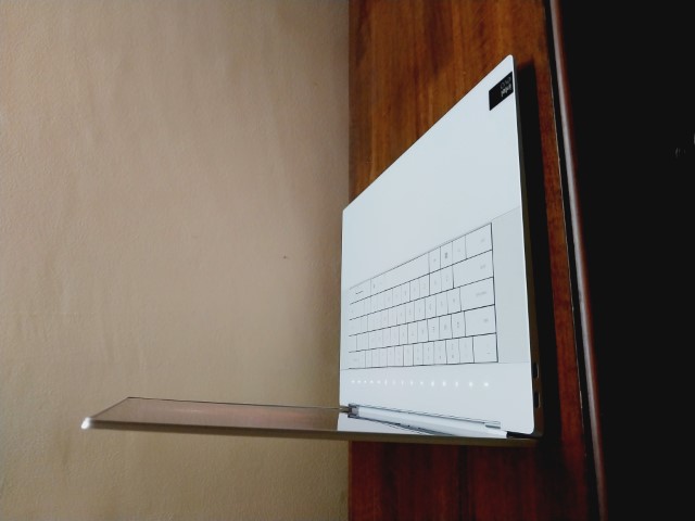 A Dell XPS 16 9640 sitting on a clean, modern desk in a professional office environment.
