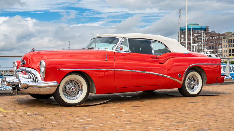 A 1953 Buick Roadmaster Skylark in white with chrome wire wheels.