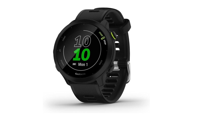 The Garmin Forerunner 55 sports watch with a circular digital display and white silicone band.