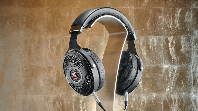 Focal Utopia high-end headphones resting on a professional headphone stand.