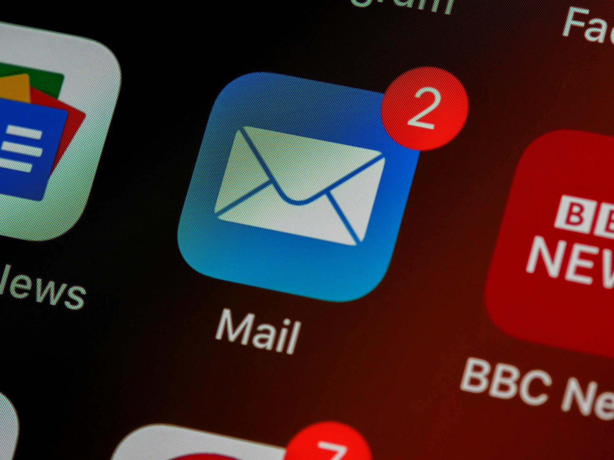 A person organizing digital mail icons representing the process of unsubscribing from junk emails.