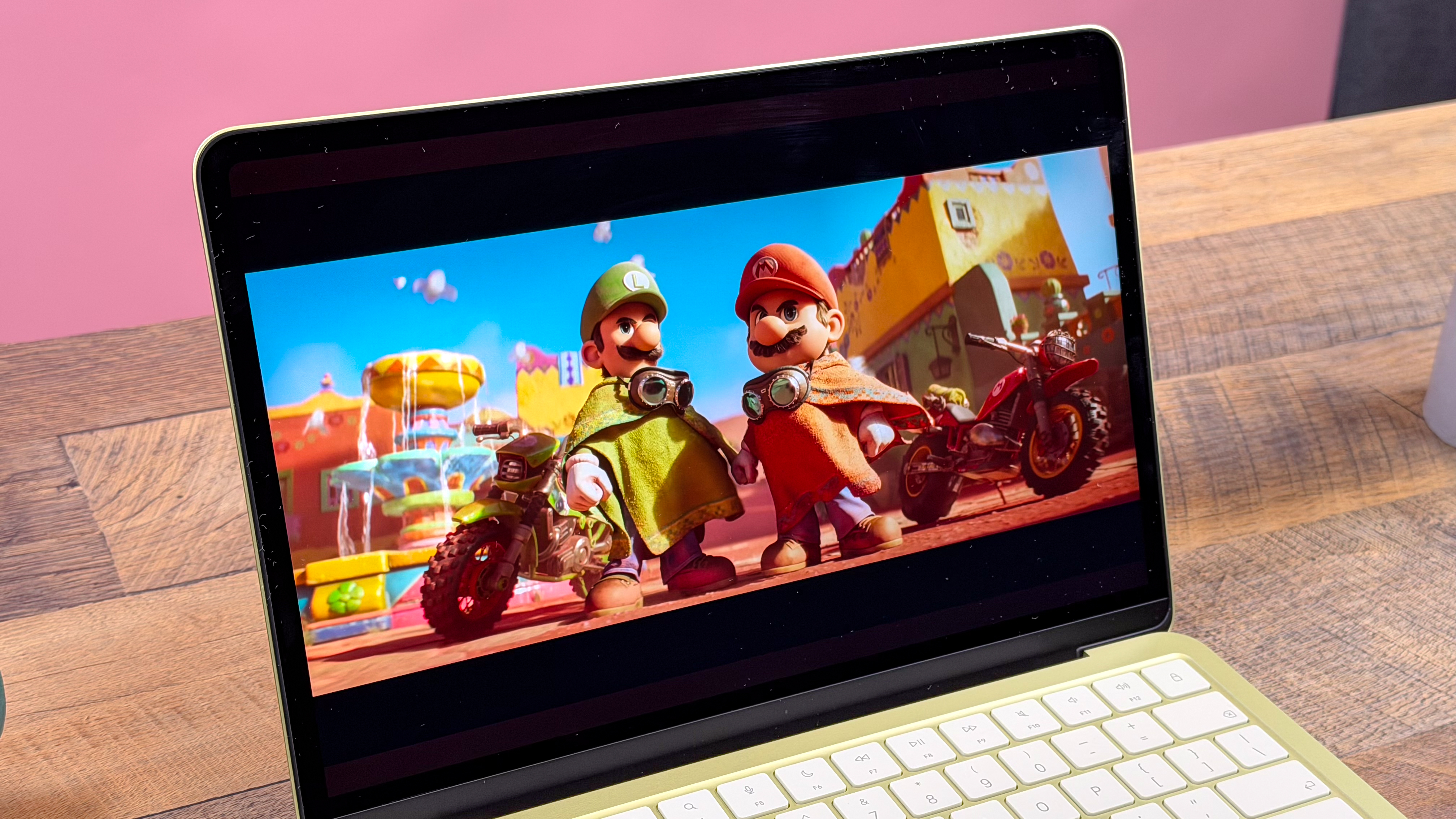 The MacBook Neo Liquid Retina display showing the macOS desktop.