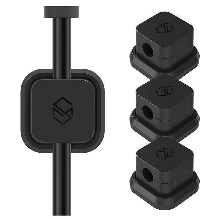 Sinjimoru magnetic cable clips holding various charging cables in place on a desk edge.