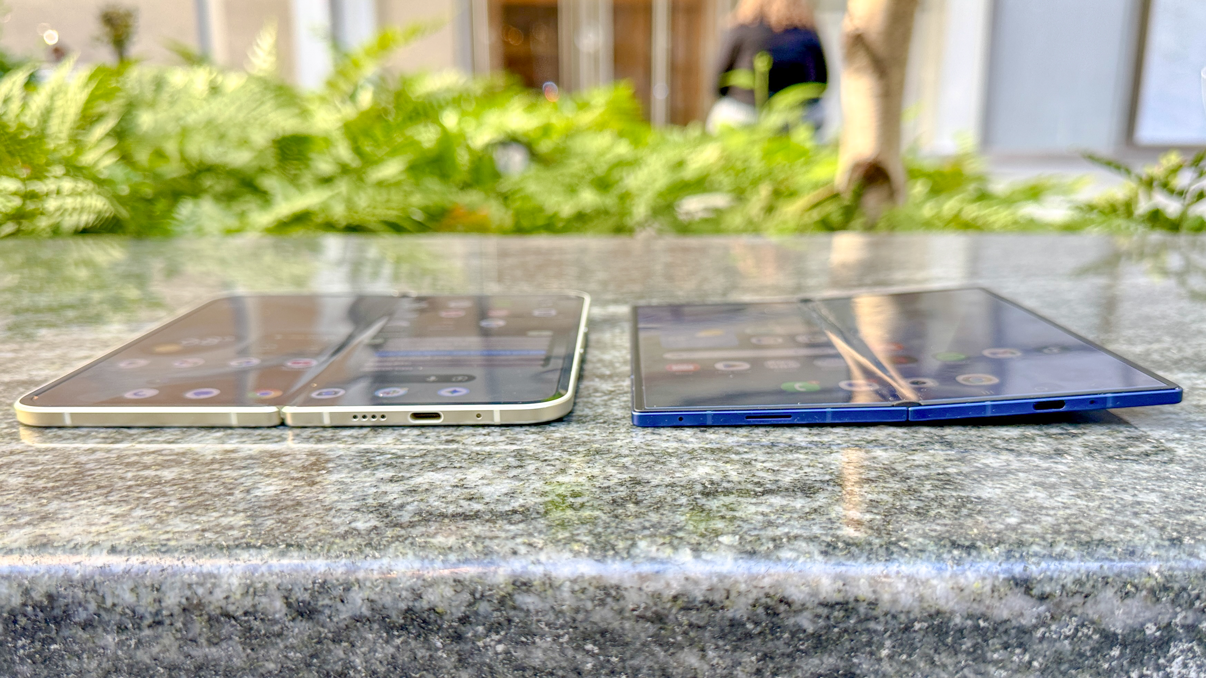 A person holding the Pixel 10 Pro Fold in one hand to show its scale.