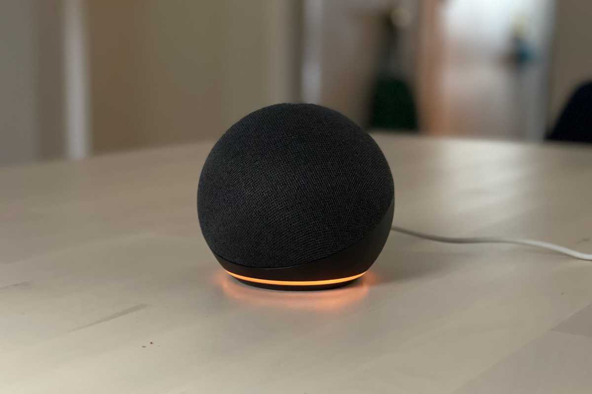 Amazon Echo device with a spinning orange light ring.