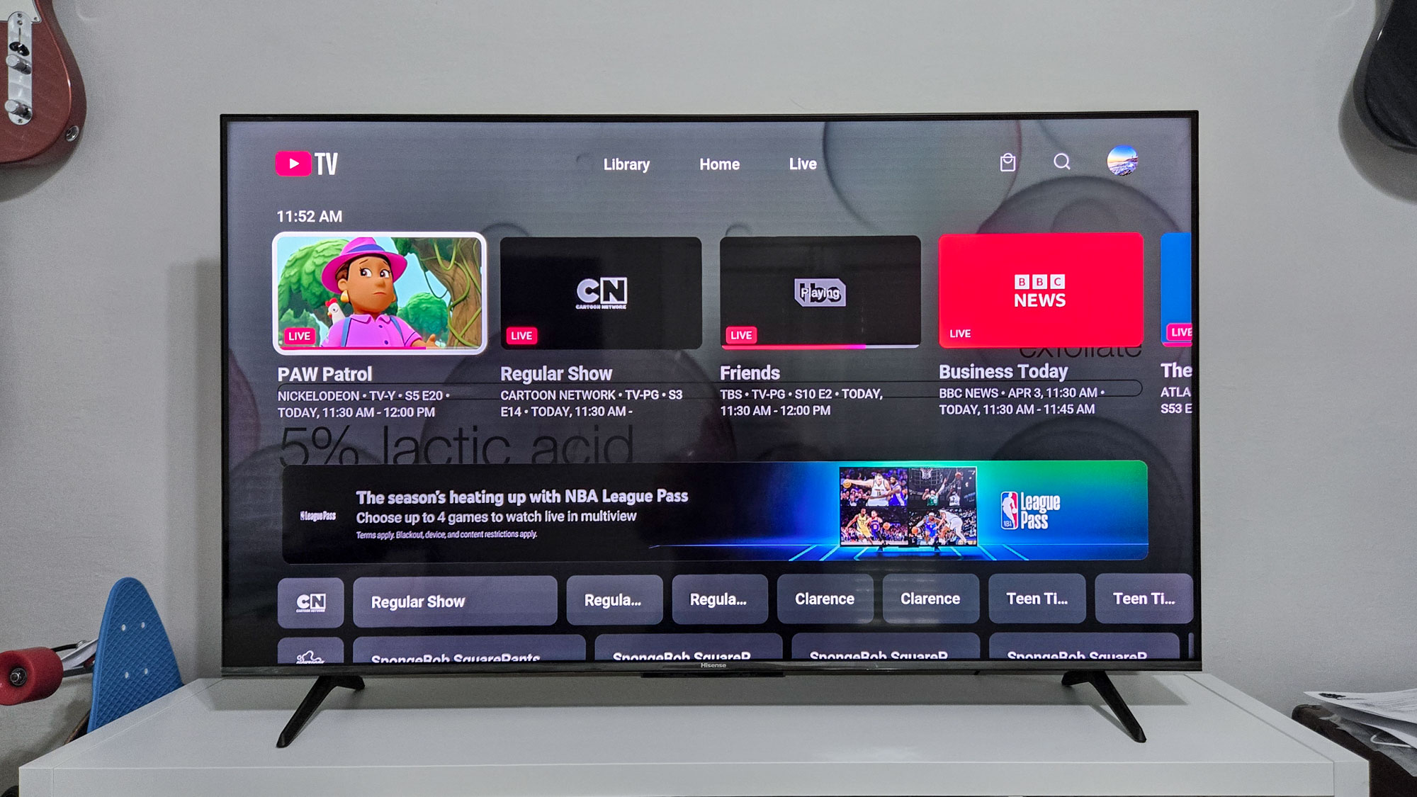 The YouTube TV home screen interface showing live program previews and navigation tabs.