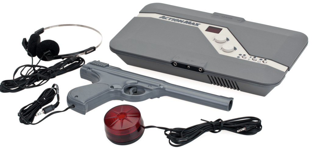 The Action Max console shown with its light gun and a specialized VHS tape.
