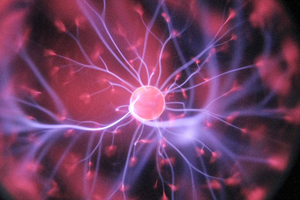 An abstract representation of a glowing neural network shaped like a human brain.