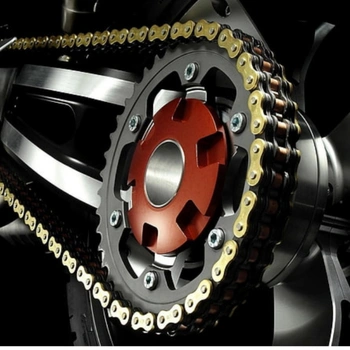 A side-on view of a motorcycle rear sprocket and drive chain assembly.