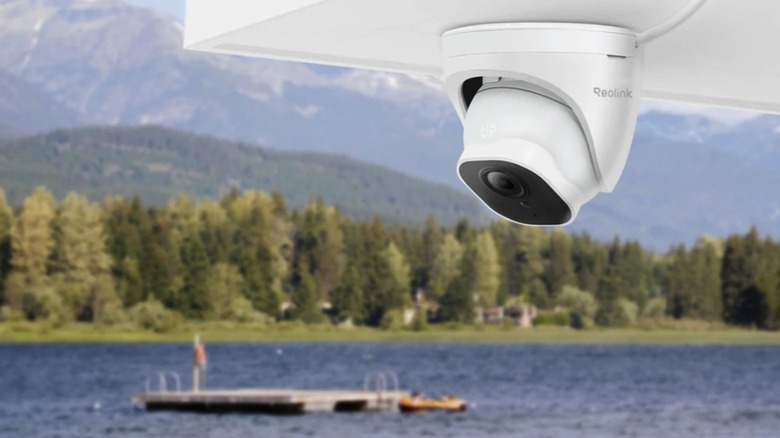 Reolink RLC-520A outdoor security camera with a scenic landscape in the background.